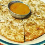 Chatamari Newari feito com farinha de arroz, carne e especiarias